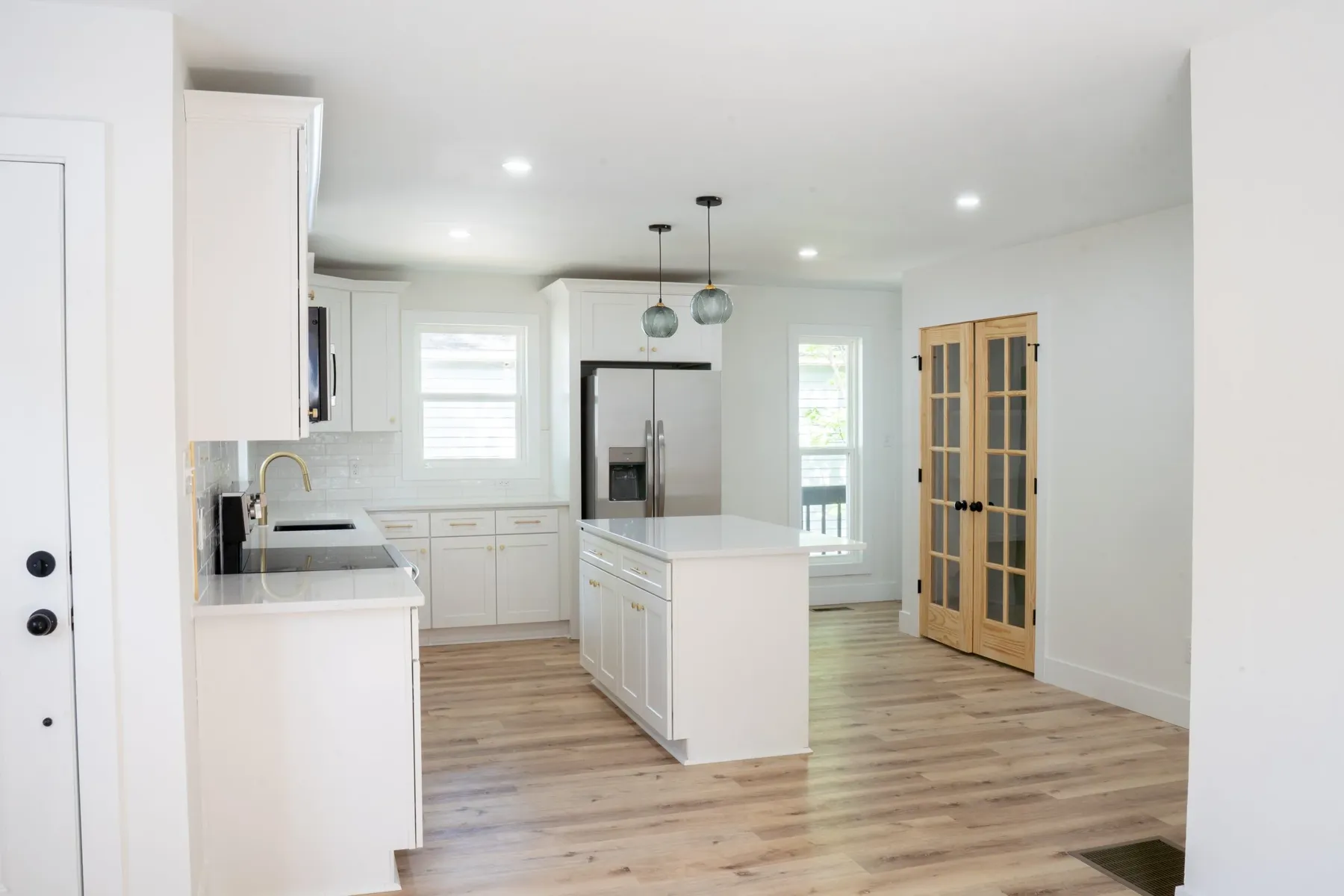 Open kitchen looking toward French doors
