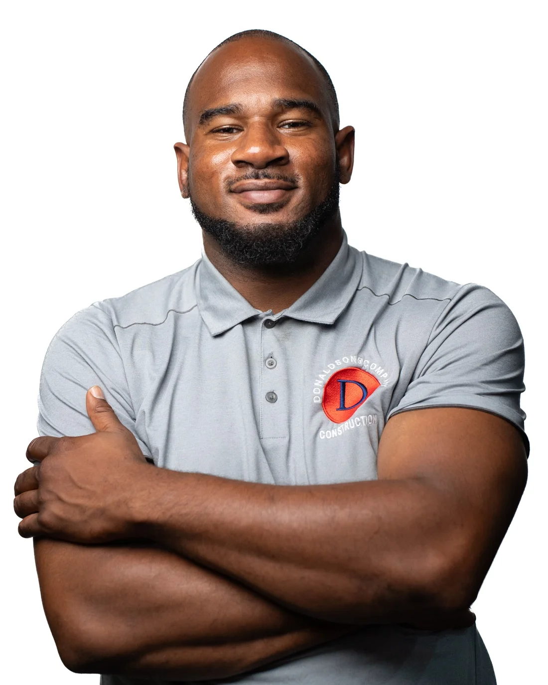 Kirk Donaldson, founder and CEO, arms crossed in a Donaldson and Company polo
