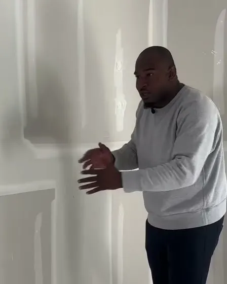 Kirk explaining taped and bedded drywall